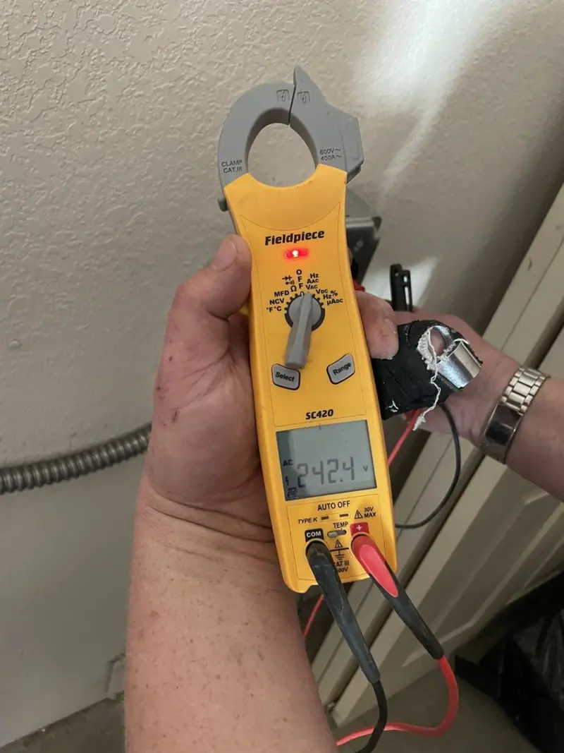 Voltage testing with clamp meter during Generator Installation in Dunedin